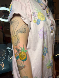 a woman with a tattoo on her arm