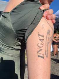 a woman with a tattoo on her arm